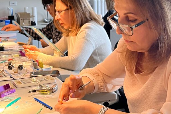 A course attendee adds details into the composite restoration in an anterior exercise at Corky Willhite's course at Cosmedent's Center for Esthetic Excellence.