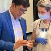 Dr. Kelcio Alves inspects the work done by a dental CE student in his composite bonding course at the Center for Esthetic Excellence at Cosmedent.