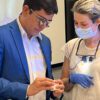Dr. Kelcio Alves inspects the work done by a dental CE student in his composite bonding course at the Center for Esthetic Excellence at Cosmedent.