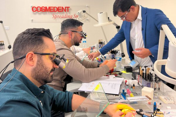 Dr. Klecio Alves guides students in his composite restoration course at the Cosmedent Center for Esthetic Excellence.
