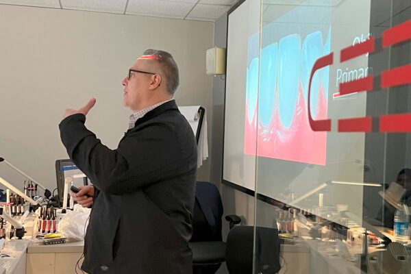 Dr. Arthur Volker explains the next hands-on composite restoration exercise in his cosmetic dentistry course at Cosmedent's Center for Esthetic Excellence.